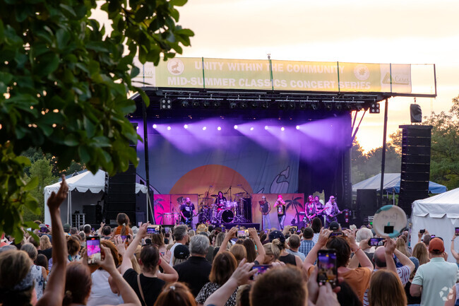 Bret Michaels with the band entertains the crowd at the mid-summer concert series.