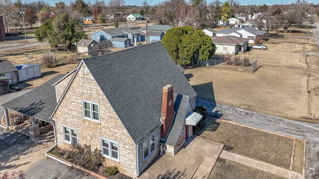 A charming Tudor stands proudly on the corner in Minco, OK.