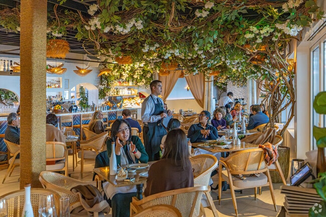 Trata’s interior blends modern design with Mediterranean warmth.