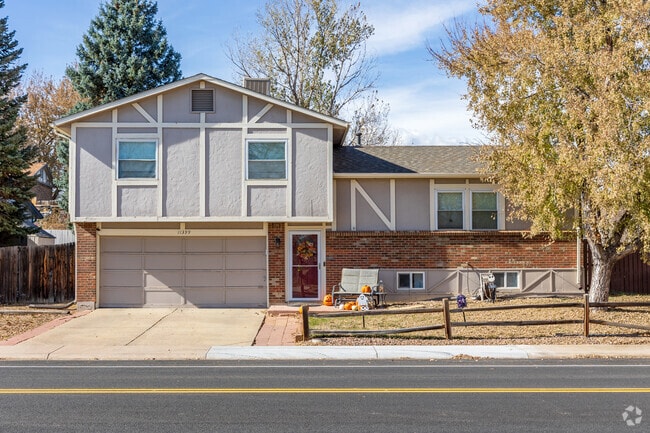 Split-level ranch style home sits just across the street from Sherwood Park.