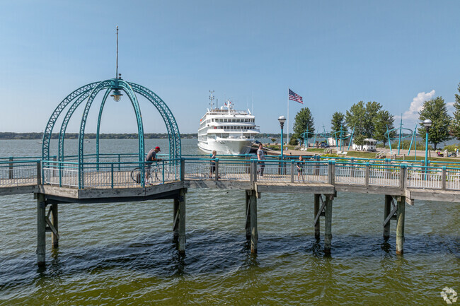 Locals ride bikes or take a stroll across the bridge over Muskegon Lake at Heritage Landing.