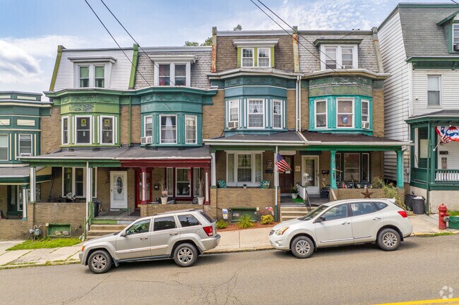 Colorful touches highlight Victorian details on Jalappa-attached single-family homes.