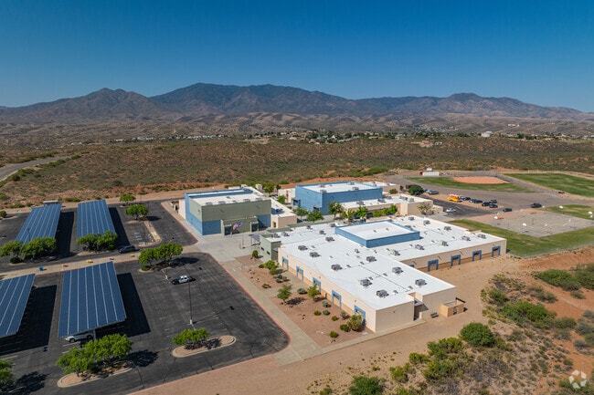 The school features a clean, modern campus with solar panel installations and convenient on-site parking.