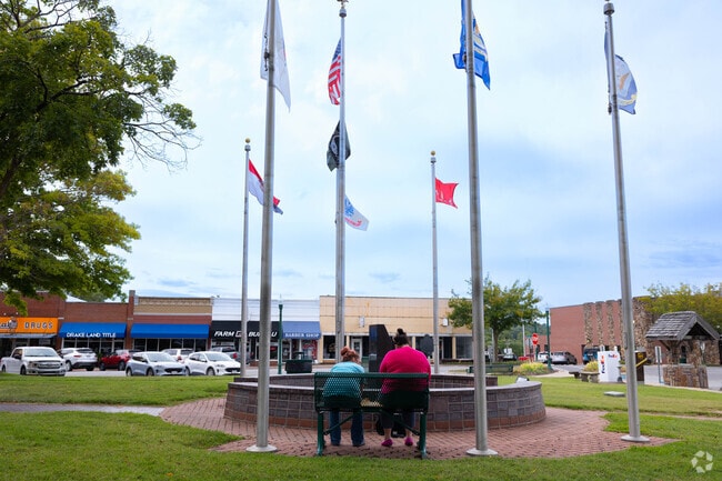 Benches near the Benton County Courthouse offer shaded seating.