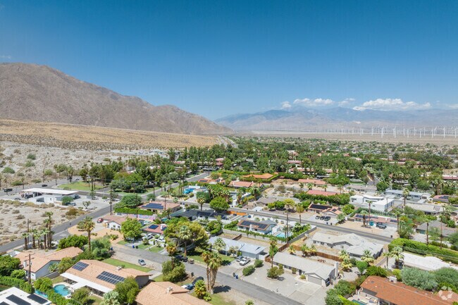A sprawling view of the Racquet Club West neighborhood with a view of the wind farms.