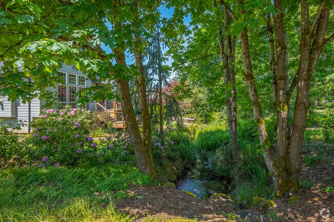 Homes along Coffee Creek enjoy soothing water views and shady greenbelts.