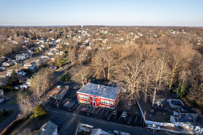 Neshaminy Valley Montessori School sits on a quite street surrounded by trees.