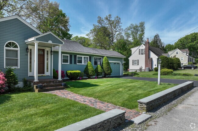 Rows of well-kept homes line the streets of Pine Hill, showcasing a blend of classic New England architecture.