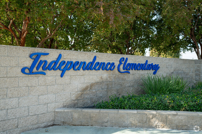 Independence Elementary Sign Welcomes students by the bus loop.