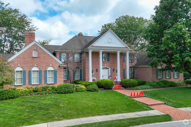 Colonial style homes with beautiful landscaping can be found throughout East Lake.