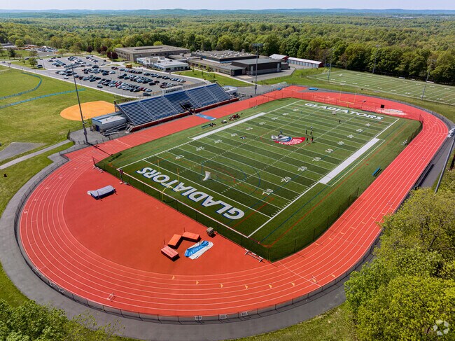 Goshen Central High School track and football field keep young minds alert.