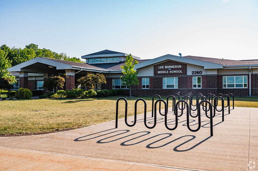 Bike racks are located outside of the main entrance of Lee Burneson Middle School.