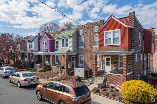 Many brick row homes in West Hill have colorfully painted details.