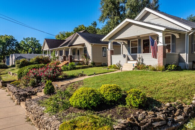 Brightly colored homes line the streets of the quiet Redbud and sunset neighborhoods.