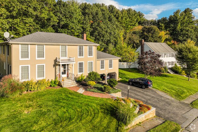 Shrewsbury homes often have manicured lawns, driveways and garages.