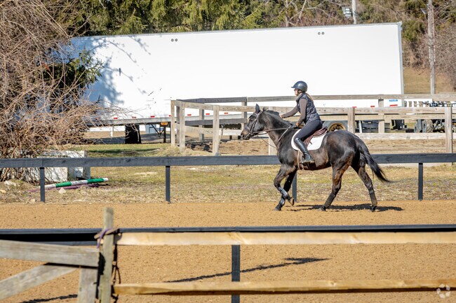 Horse stables at Gold Coast Equestrian bring equestrian charm to Old Brookville.