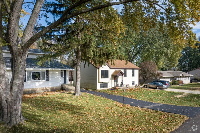 Rows of quaint homes sit beneath large trees in Lakeland Park.