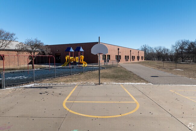 There is an outdoor basketball court at Colvin Elementary School.