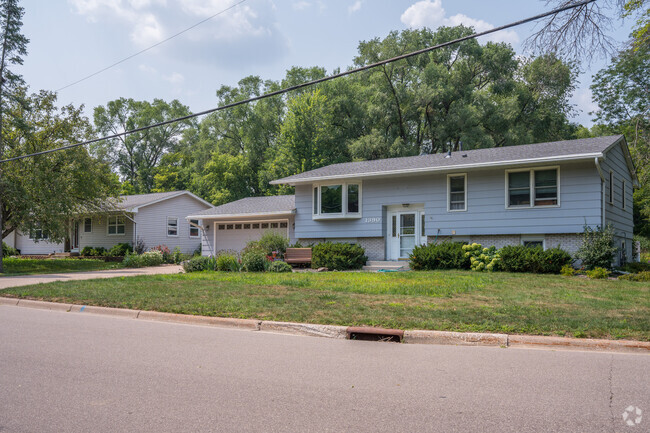 A 1960's era home with an attached garage in Newport.