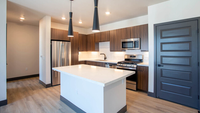 Kitchen with Breakfast Bar and Stainless Steel Appliances