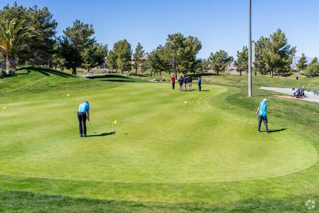Golfers practice their putting at Rancho Vista Golf Club in nearby Quartz Hill.