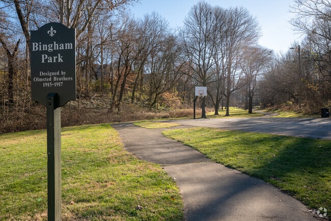 Bingham Park features a walking path that connects the basketball courts with the playground.