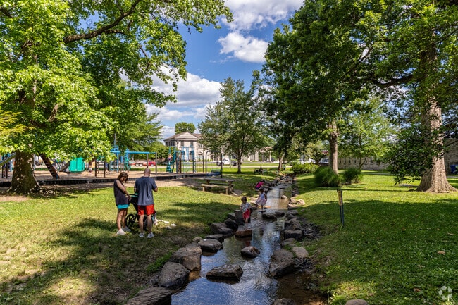 Kids play in the stream at Fountain City Park.