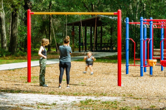 Families enjoy the playground at Liberty Community Park.
