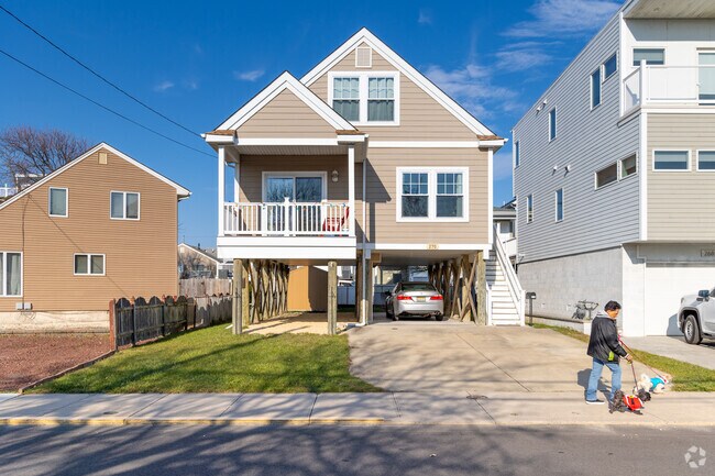Classic beach bungalows on pilings blend timeless design with flood-resilient practicality, just blocks from the shore at Seaside Heights, NJ.