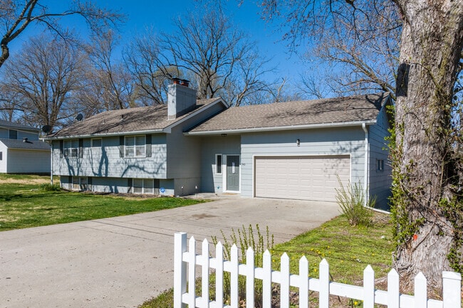 A classic split-level home in Maple Park, featuring a broad driveway, attached garage, and a simple, welcoming exterior.