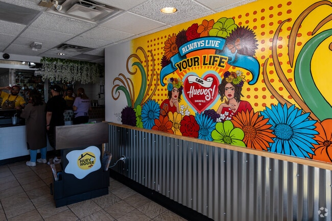 The mural at Huevo House welcomes Southwest Bakersfield guests as they check in to be seated.