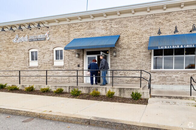 Laura's Bar and Grill has a steady stream of patrons and always a full parking lot.
