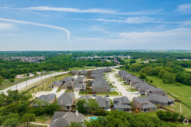 Village Creek is a sub-division in Kennedale featuring traditional homes with brick exteriors.