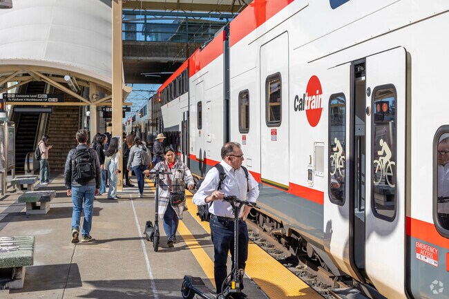 Telescope Hills Commuters board Caltrain at the Millbrae Station, a transit hub for the Bay Area.