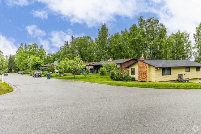 Homes in Spenard stretch down tree lined streets, with ample front yard space for greenery.