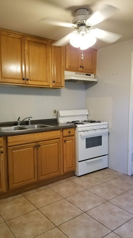 Kitchen includes Stove, Refrigerator