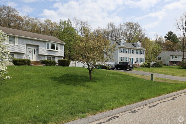 Rows of split level and colonial homes fill Billerica streets.