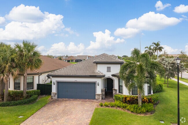 Contemporary Spanish Revival homes framed with palm trees are a regular occurence in Park Ridge.