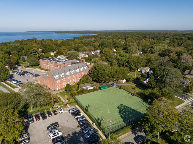 Sag Harbor Elementary School has a big fenced in basketball court.