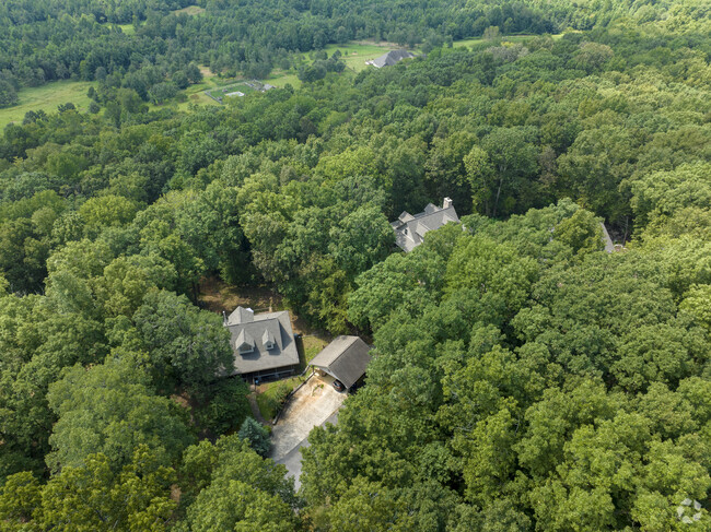 Gated Mediterranean style homes offer seclusion in this natural and forested subdivision.