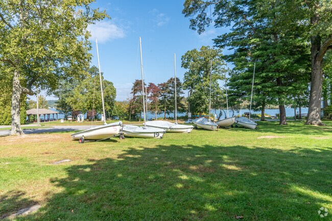 Residents of East Hampton enjoy gazing upon passing boats on Lake Pocotopaug.