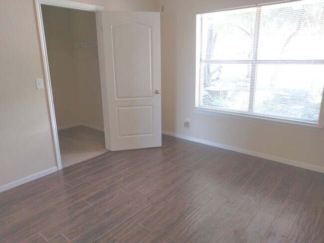 Bedroom with walk-in closet
