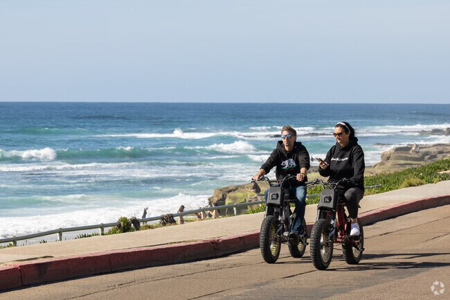 Locals can ride their bikes along Neptune Place and watch the huge waves.