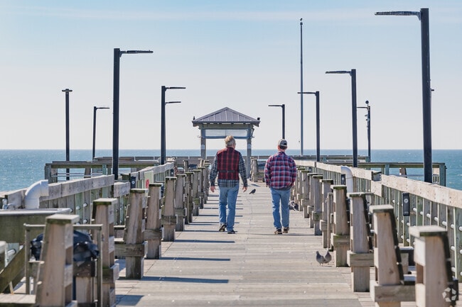 Oak Island Pier is a popular saltwater fishing spot where anglers catch large Bluefish.