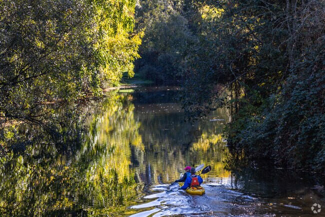 Kayakers paddle the Sammamish River by Wilmot Gateway Park near West Ridge.