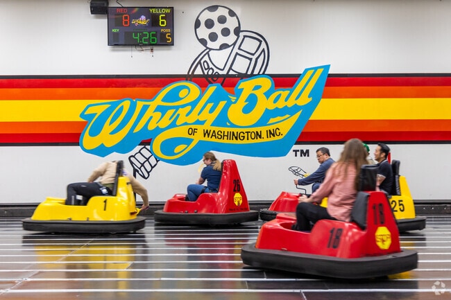 Whirlyball players in Esperance ride bumper cars while scoring points with lacrosse shots.