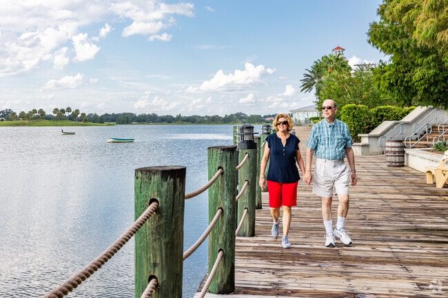 Residents of the Village of Tamarind Grove often walk the boardwalk at Sumter Lake Landing.