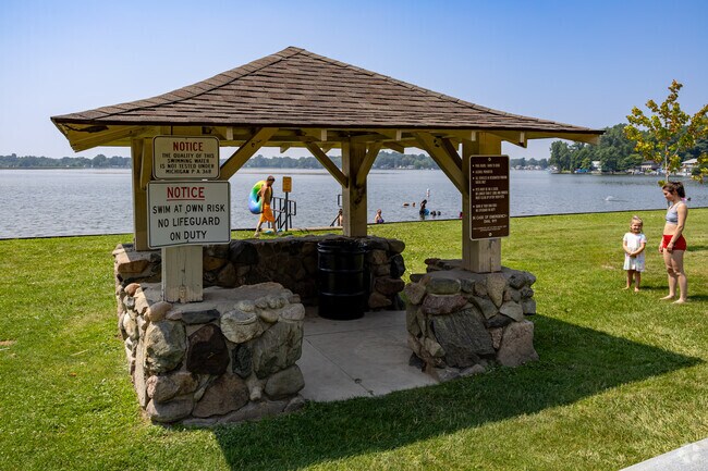 A small pavilion at Gilletts Lake Park provides beachside shade for families visiting the park.