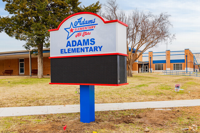 Close up shot of the signage of Adams Elementary School.