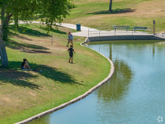 Enjoy a nice walk by the lake at Greenfield Park in East Mesa, near Superstition Springs.